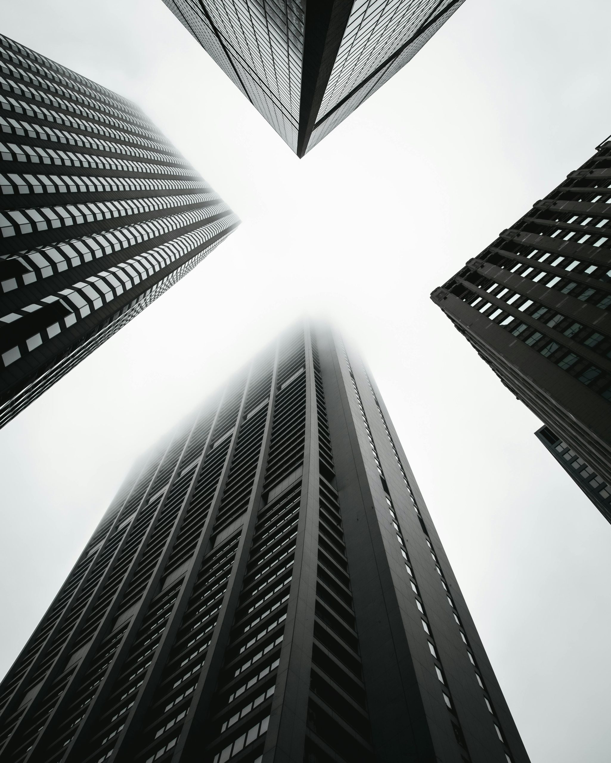 Dramatic low-angle shot of skyscrapers in Chicago creates a geometric urban scene.